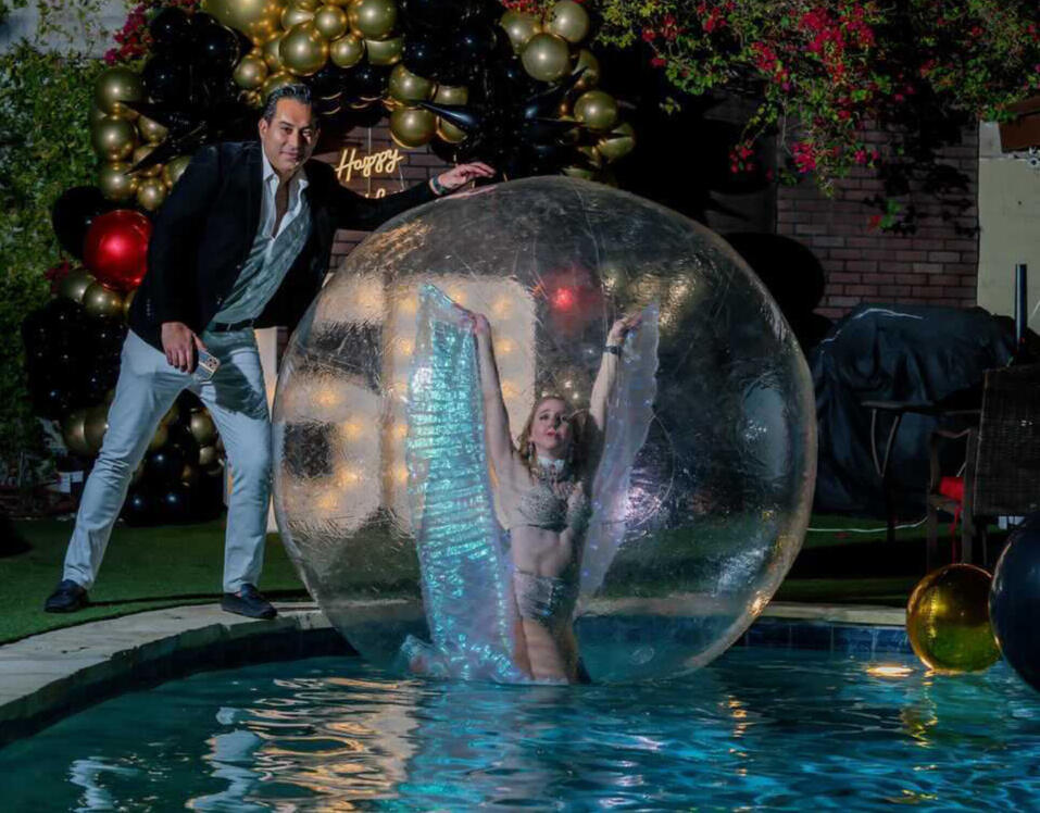 Acrobat in Bubble Sphere on Pool